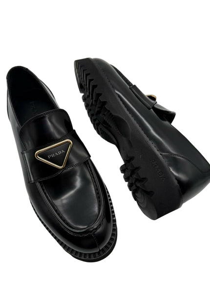 МУЖСКІЯ ЛОФЕРЫ З ТРЫКУТНЫМ ЛОГО ТАПОЧКІ ДЛЯ АХОВЫ Абутак