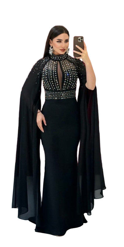ELEGANT BEADED GOWN WITH FLOWING CAPE DETAIL