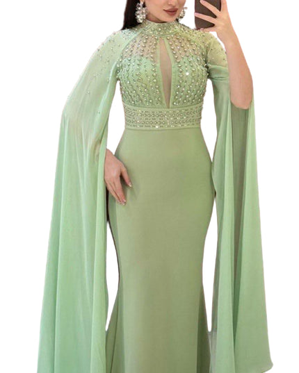 ELEGANT BEADED GOWN WITH FLOWING CAPE DETAIL