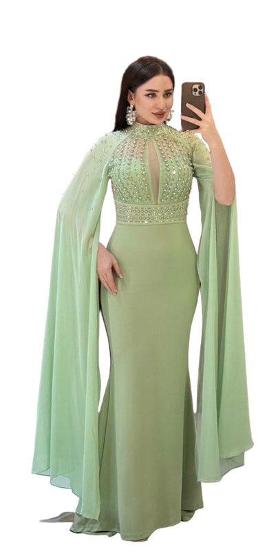 ELEGANT BEADED GOWN WITH FLOWING CAPE DETAIL